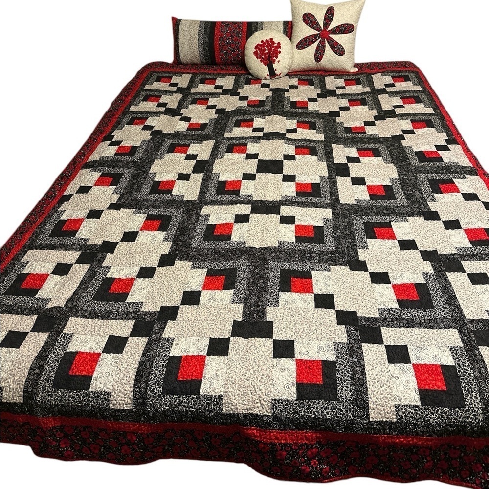 Quilt package includes one-of-kind quilt, bolster, 2 pillows.